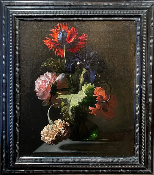 Still life of Poppies, Peonies, Iris, and African Marigold in a Green Glass Vase on a Gray Stone Ledge